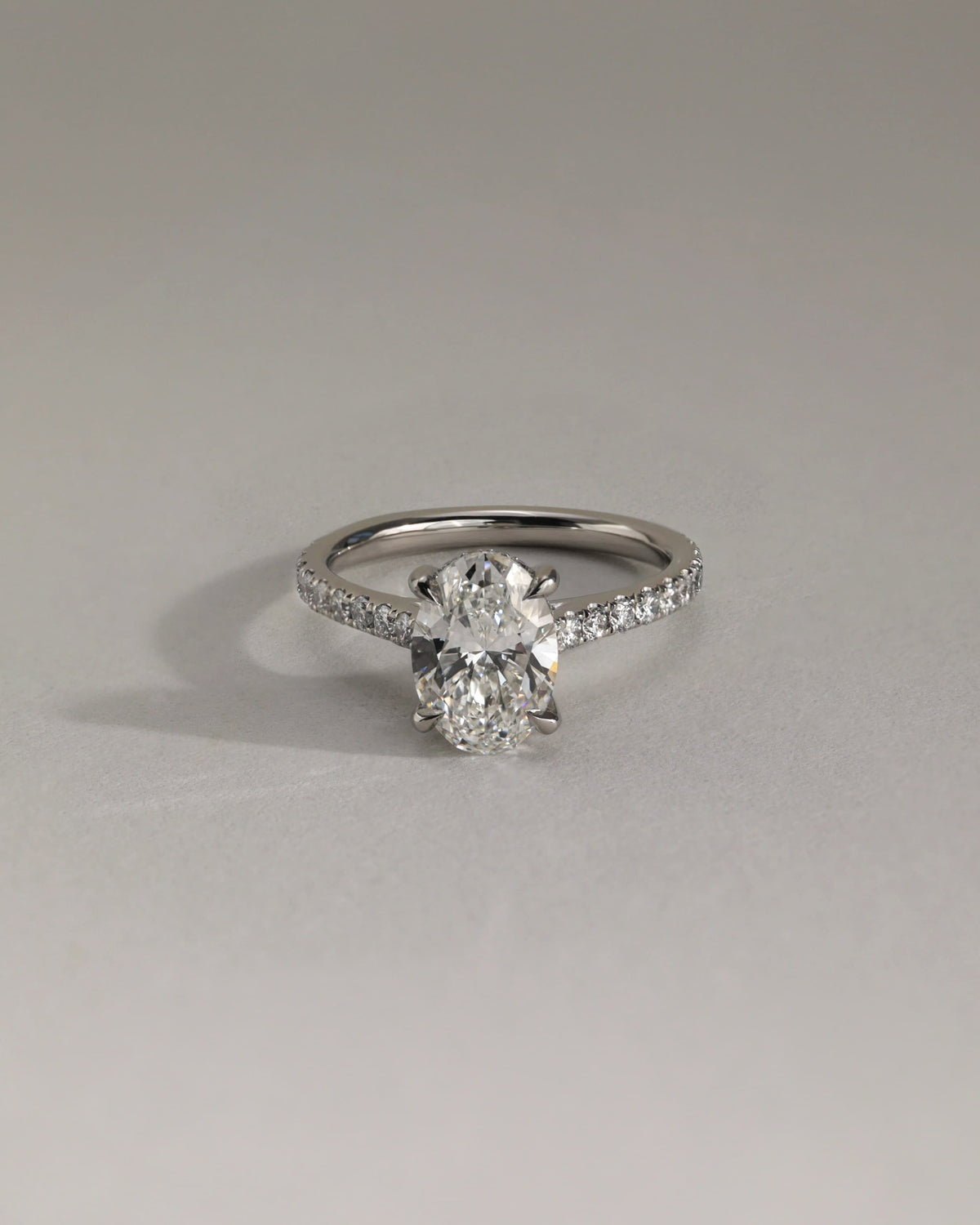 Julia - Oval Claw Solitaire with Hidden Halo, Pave Band and Cathedral High Setting Engagement Ring - White Gold