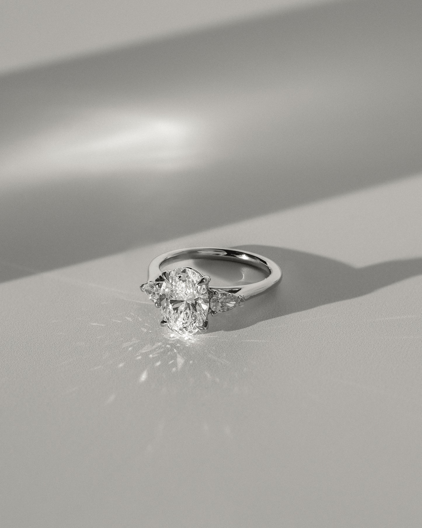 Alexia - Oval Claw Trilogy with Pear Side Stones and Cathedral Setting Engagement Ring - Rose Two-Tone - Lifestyle