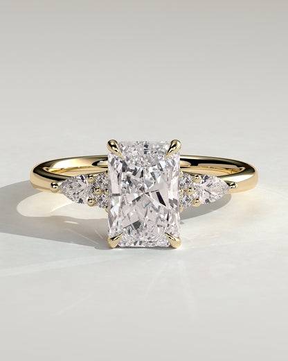 Heidi - Radiant Claw Solitaire with Pear Accents and Round Shoulder Stones Engagement Ring - Yellow Gold