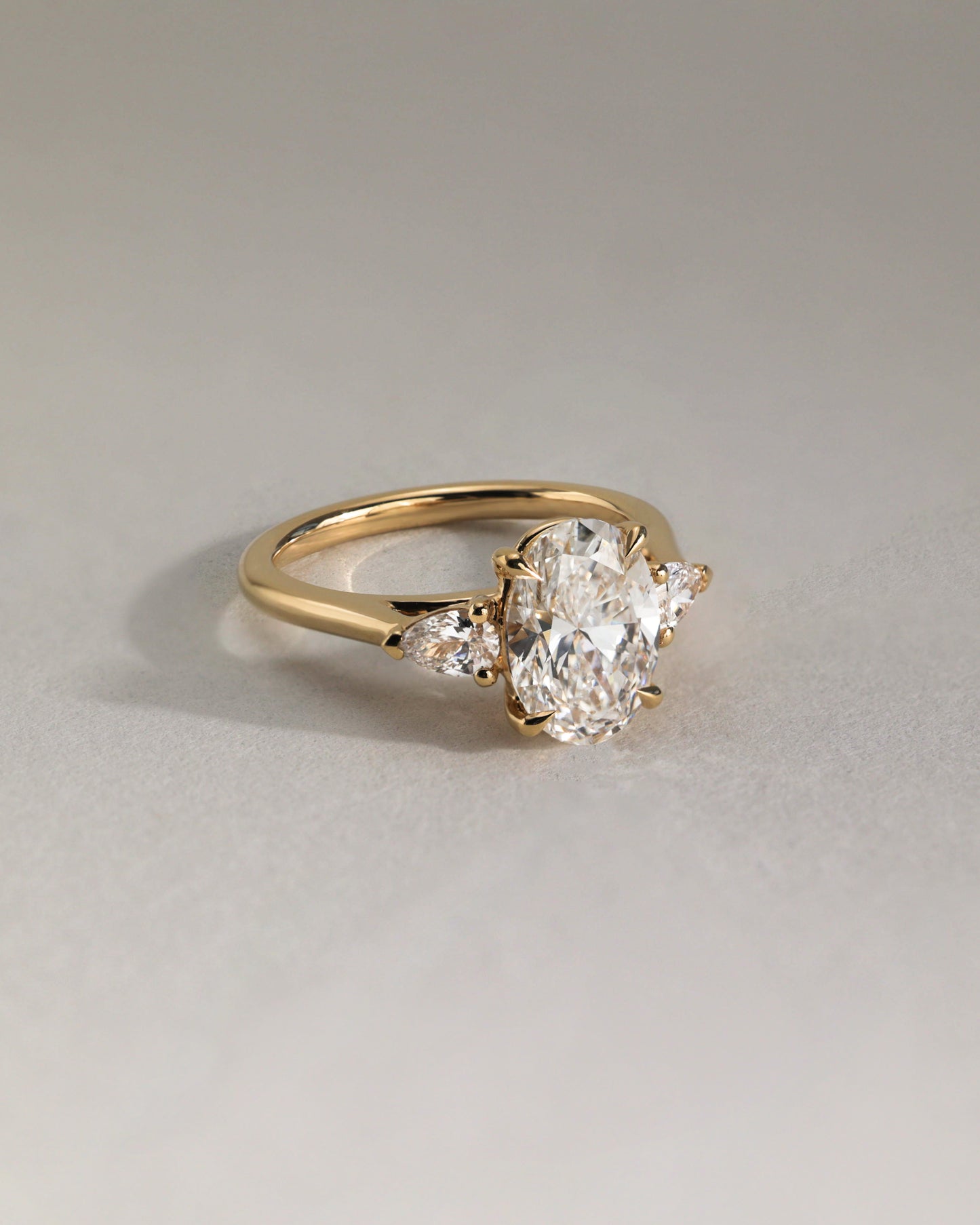 Alexia - Oval Claw Trilogy with Pear Side Stones and Cathedral Setting Engagement Ring - Rose Two-Tone - Lifestyle