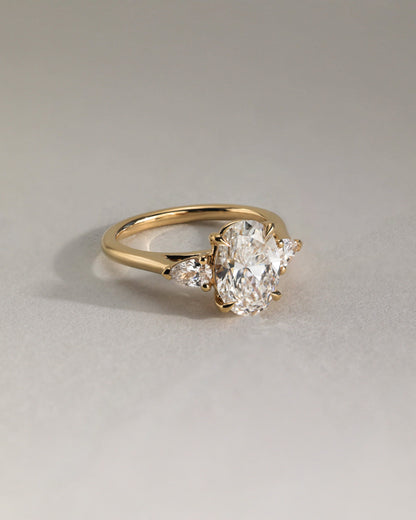 Alexia - Oval Claw Trilogy with Pear Side Stones and Cathedral Setting Engagement Ring - Yellow Gold