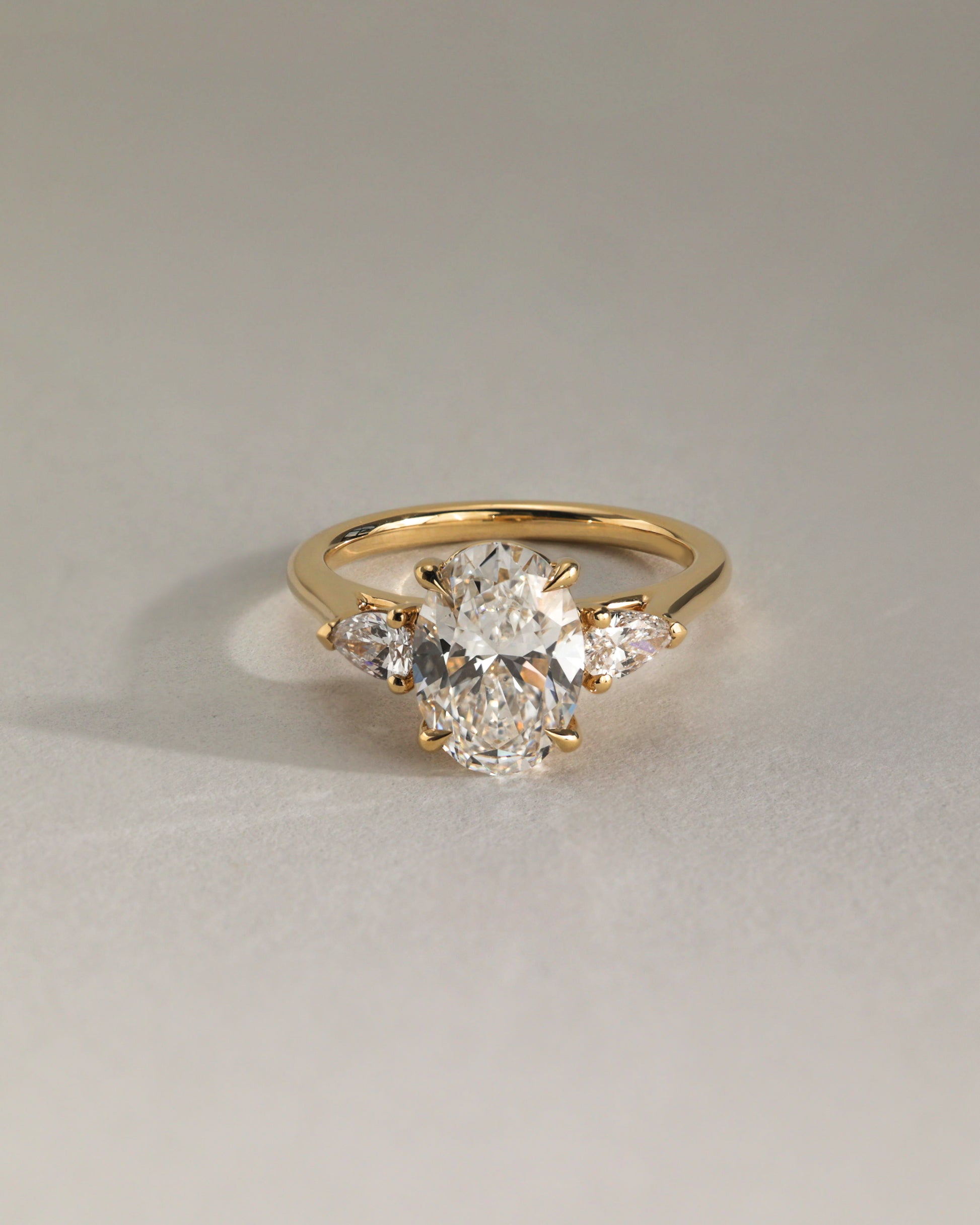 Alexia - Oval Claw Trilogy with Pear Side Stones and Cathedral Setting Engagement Ring - Rose Two-Tone - Lifestyle