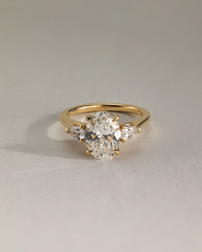Alexia - Oval Claw Trilogy with Pear Side Stones and Cathedral Setting Engagement Ring - Yellow Gold