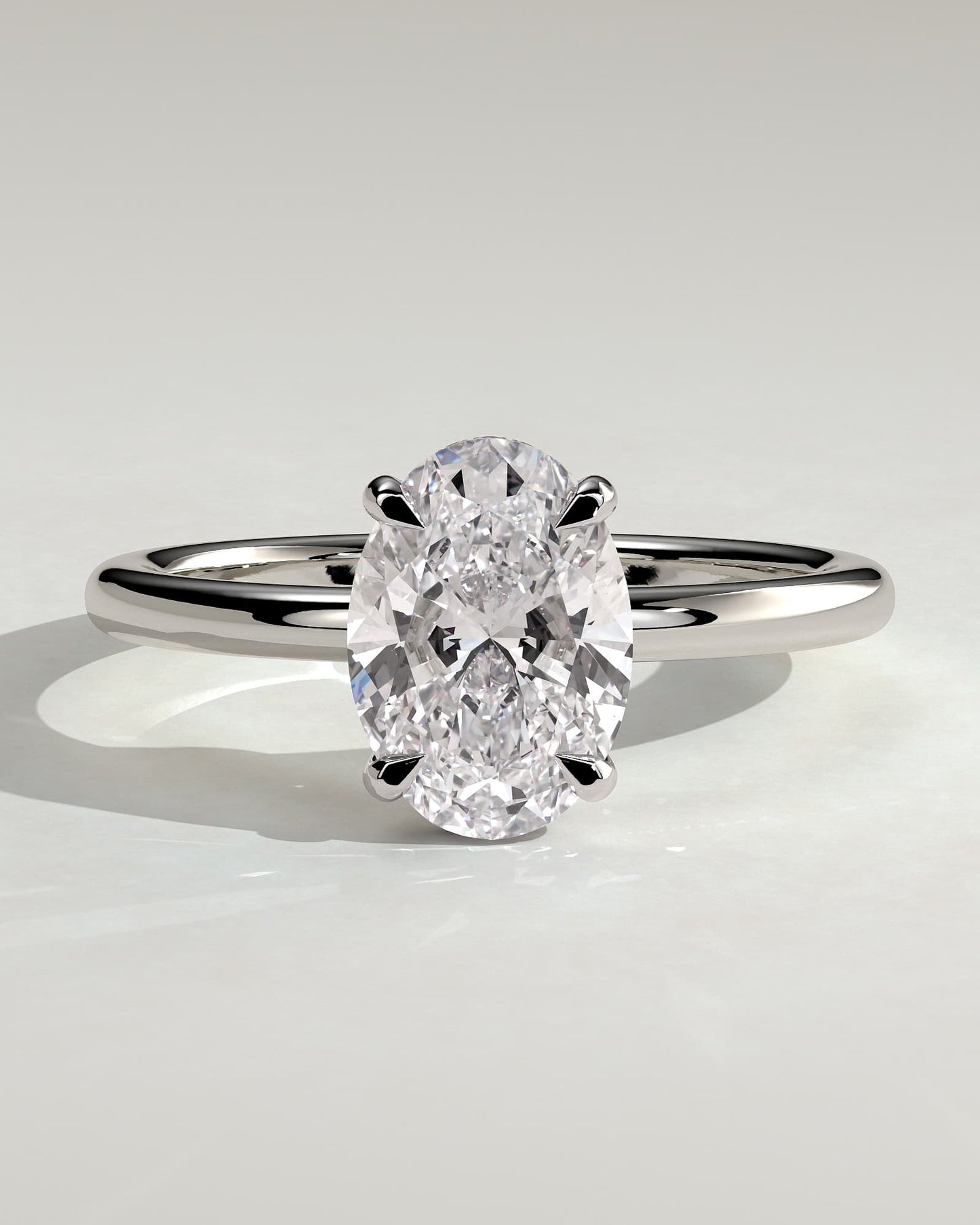 Emma - Classic Oval Claw Solitaire with Hidden Halo Engagement Ring - White Gold
