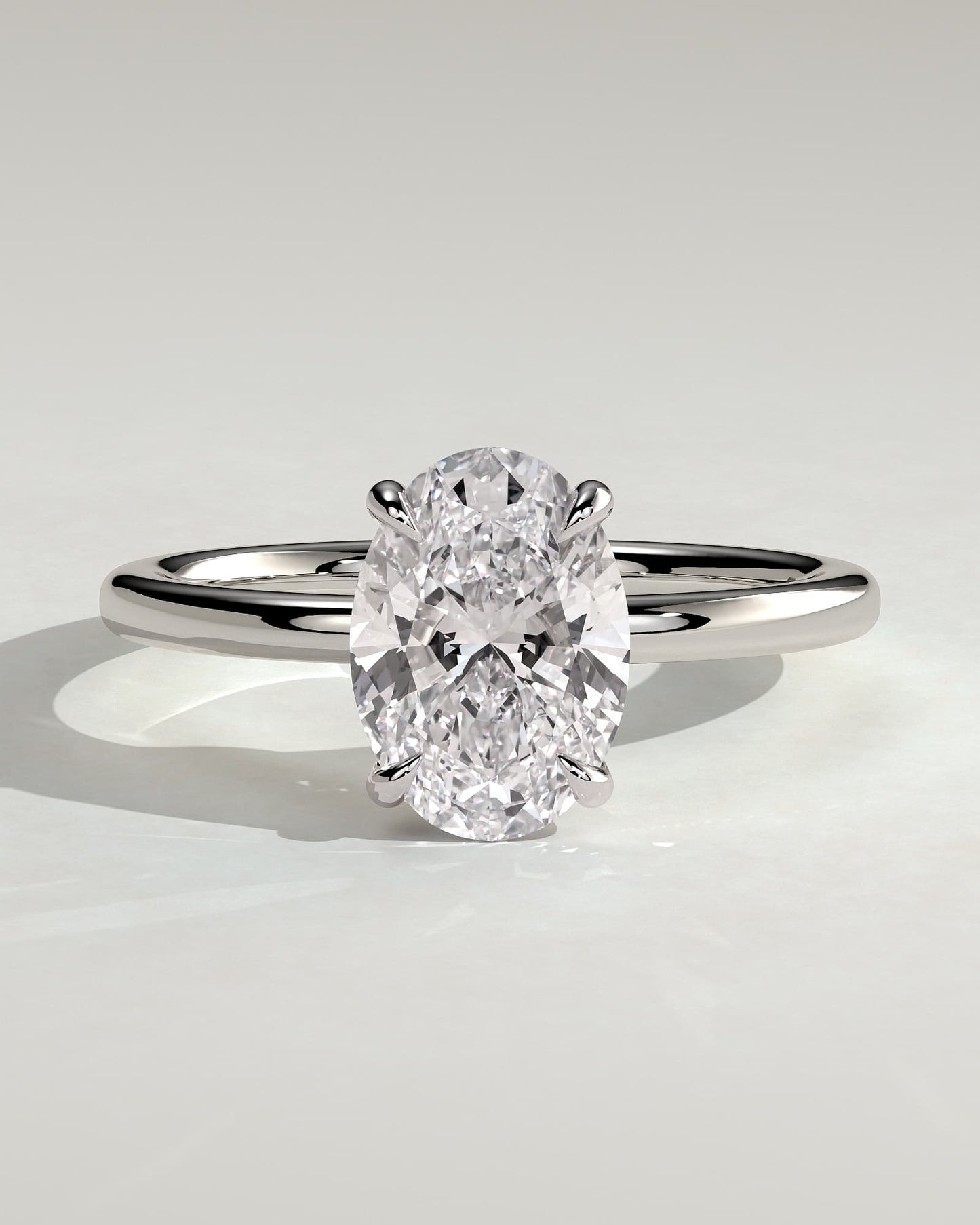 Daisy - Classic Oval Claw Solitaire Engagement Ring - White Gold
