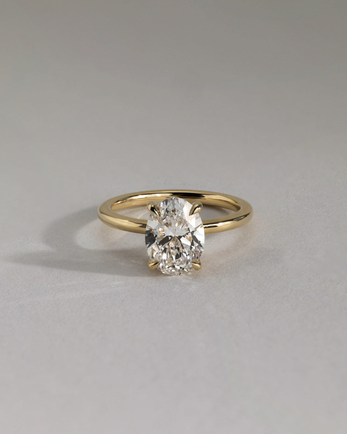 Emma - Classic Oval Claw Solitaire with Hidden Halo Engagement Ring - Rose Two-Tone