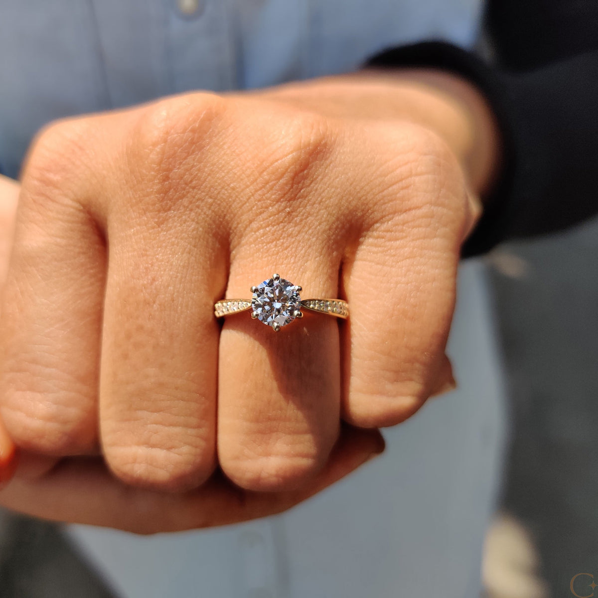 Round Cut Engagement Ring with Tapered Pave Setting