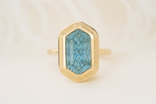the-olympia-ring-5-18-ct-hexagon-concave-cut-blue-aquamarine