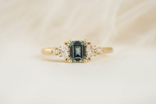 the-maeve-ring-0-64-ct-emerald-cut-blue-montana-sapphire