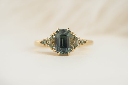 the-maeve-ring-2-59-ct-emerald-cut-teal-sapphire-green-sapphire-accents
