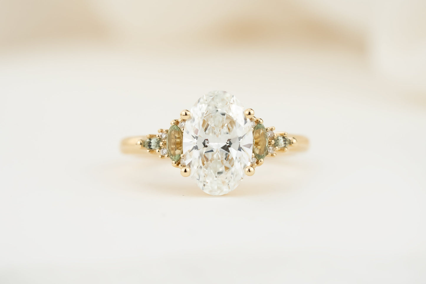 The Maeve Ring | 2.07 CT Oval Diamond + Light Green Sapphire Accents