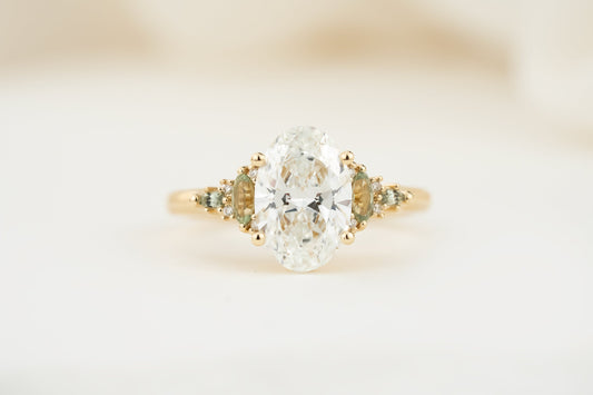 the-maeve-ring-2-07-ct-oval-diamond-light-green-sapphire-accents