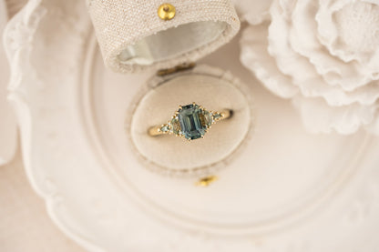 the-maeve-ring-2-59-ct-emerald-cut-teal-sapphire-green-sapphire-accents