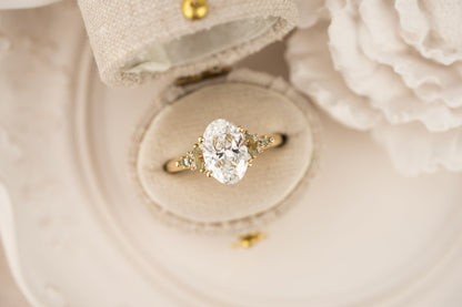 the-maeve-ring-2-07-ct-oval-diamond-light-green-sapphire-accents