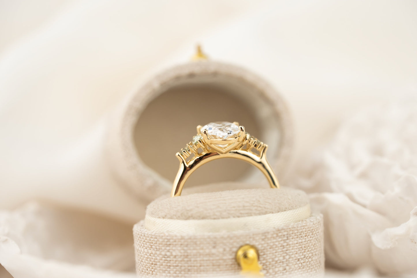 The Maeve Ring | 2.07 CT Oval Diamond + Light Green Sapphire Accents