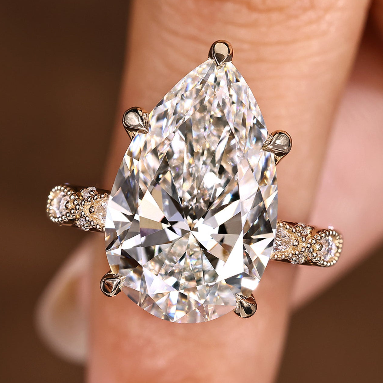 10 Carat Pear Shaped Diamond Ring with Marquise and Round Pave