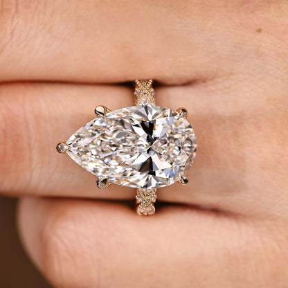 10 Carat Pear Shaped Diamond Ring with Marquise and Round Pave