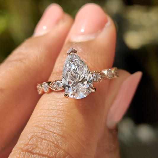 Pear Diamond Ring With Round Side Stone