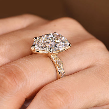 10 Carat Pear Shaped Diamond Ring with Marquise and Round Pave