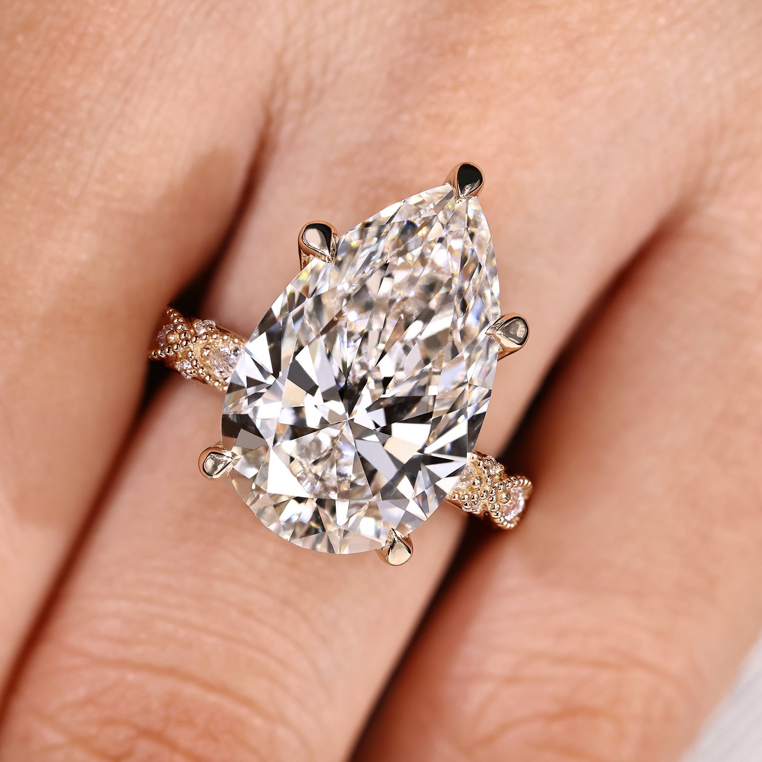 10 Carat Pear Shaped Diamond Ring with Marquise and Round Pave