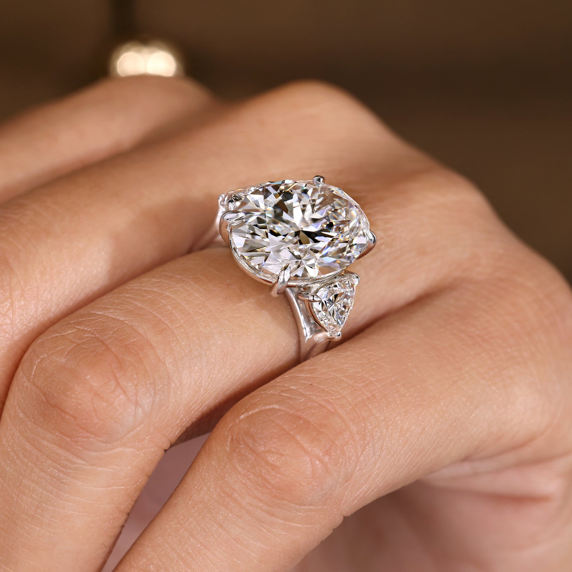 IGI Certified 10 -15 Carat Oval Diamond Ring in Three Stone Style