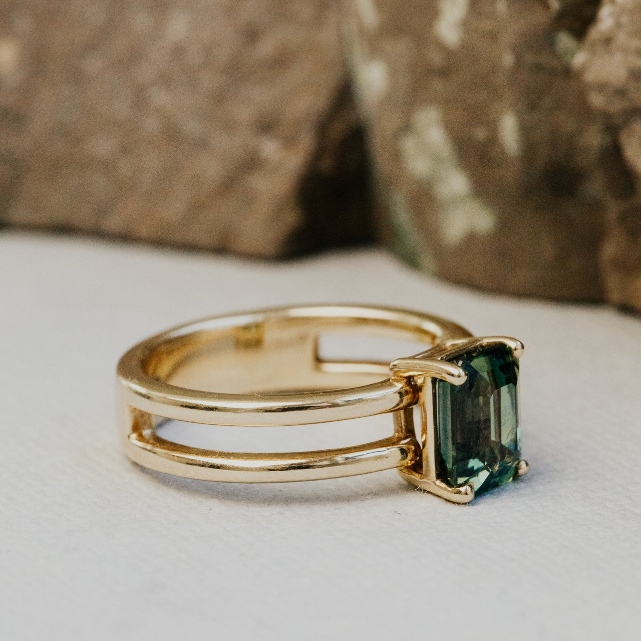 The Amanda Emerald Cut Teal Sapphire Double Band Solitaire