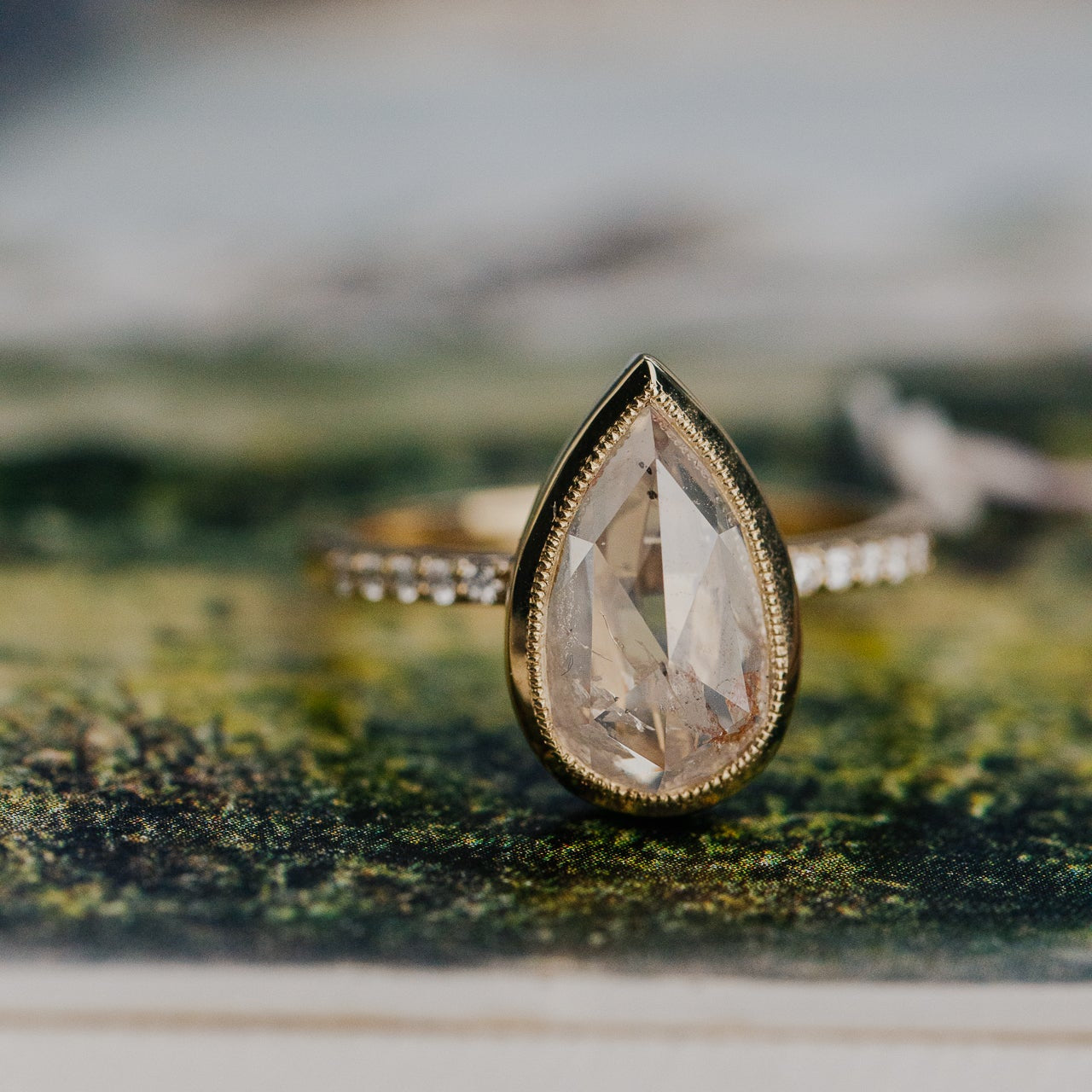 The Lyell Pear Clear and Peach Rustic Diamond Ring