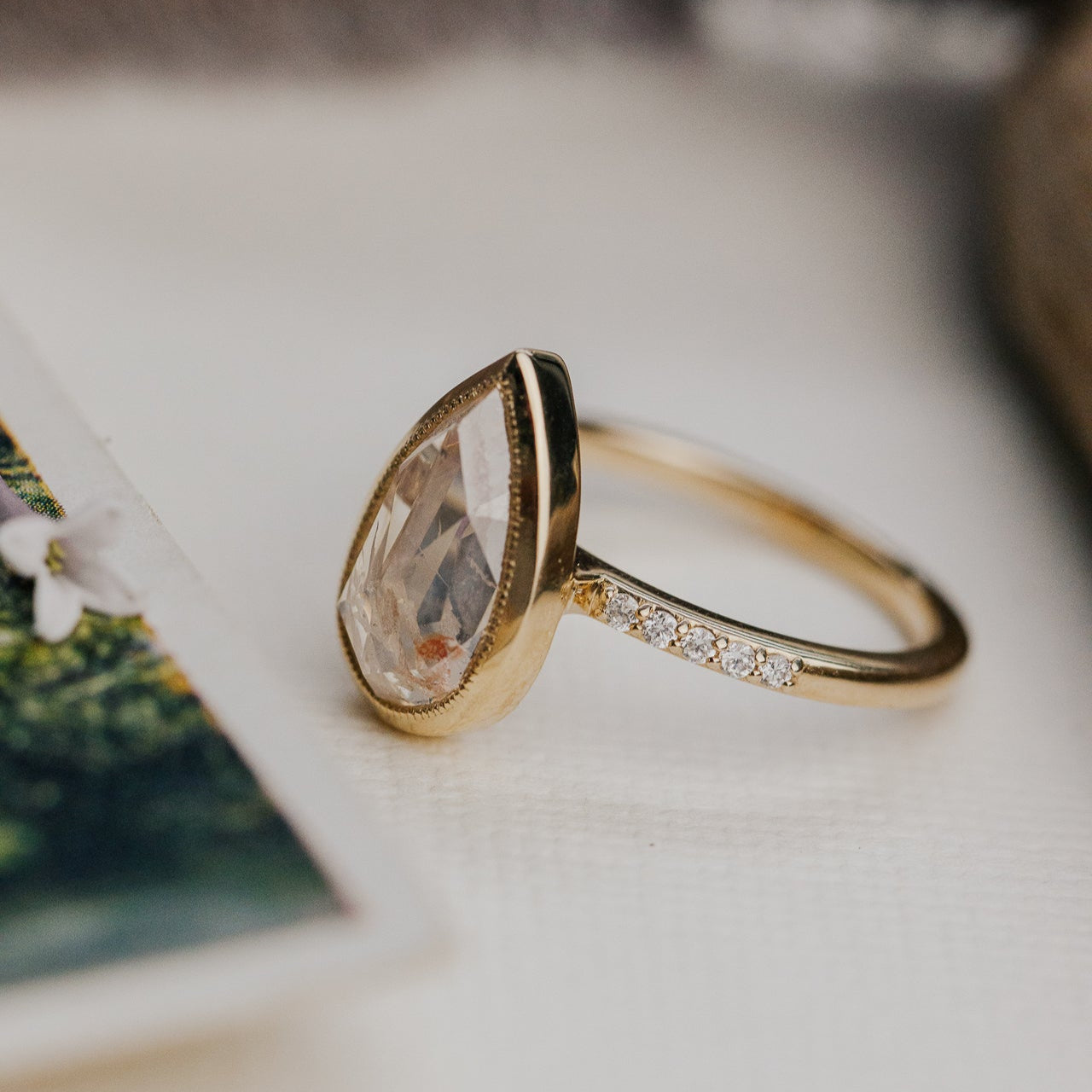 The Lyell Pear Clear and Peach Rustic Diamond Ring