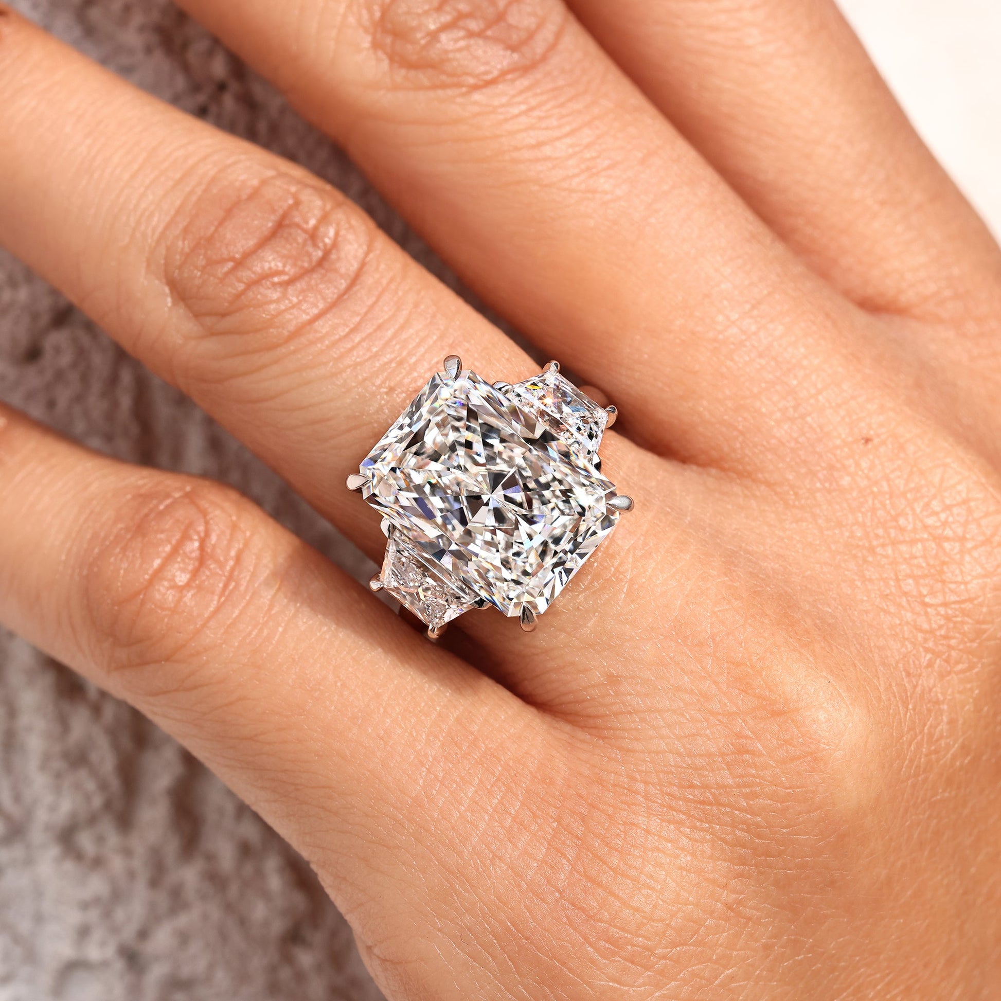 10 - 14 Carat Radiant Cut Diamond Ring with Trapezoid Side Stones