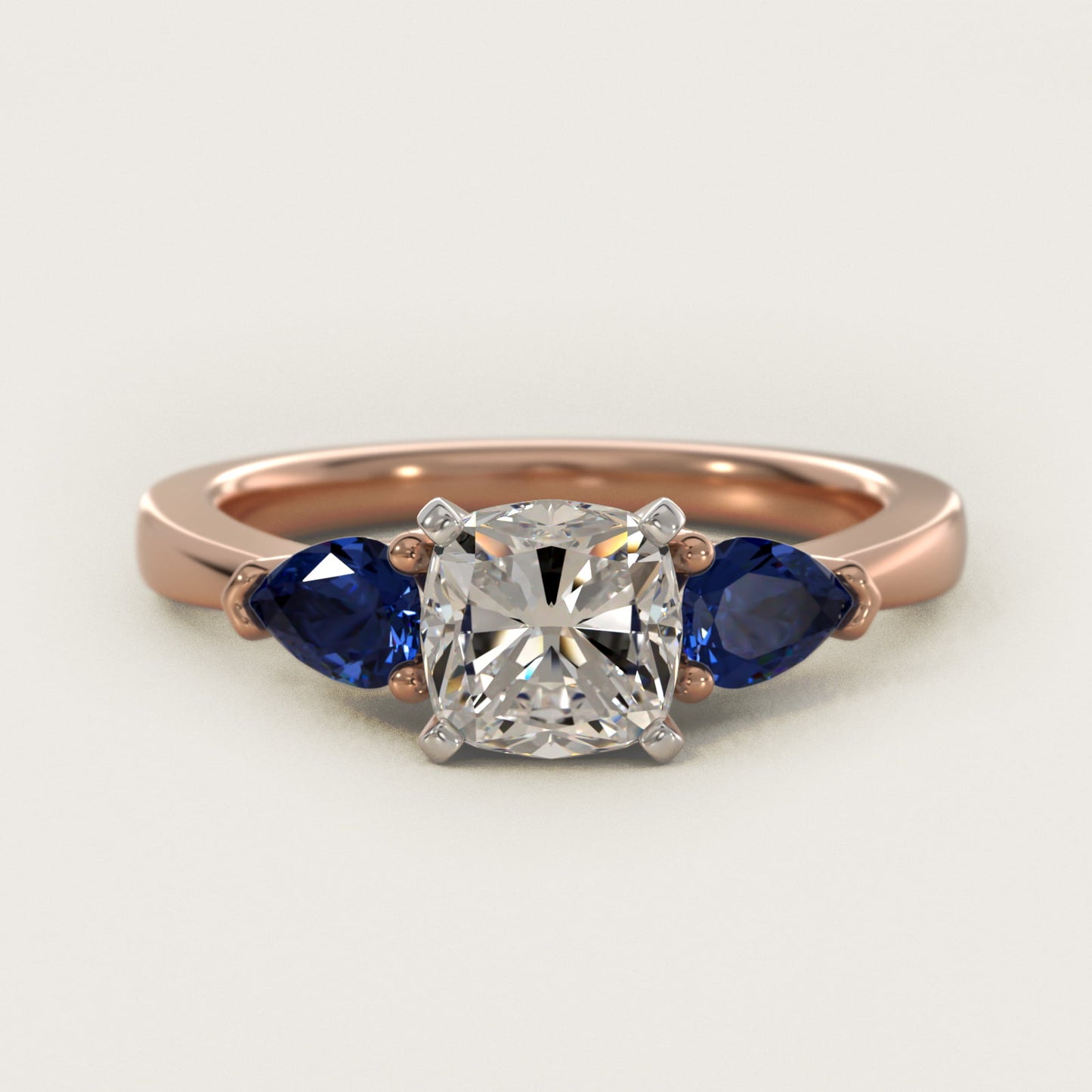 Classic Pear Shaped Sapphire Engagement Ring in 14k Rose Gold - Cushion Center