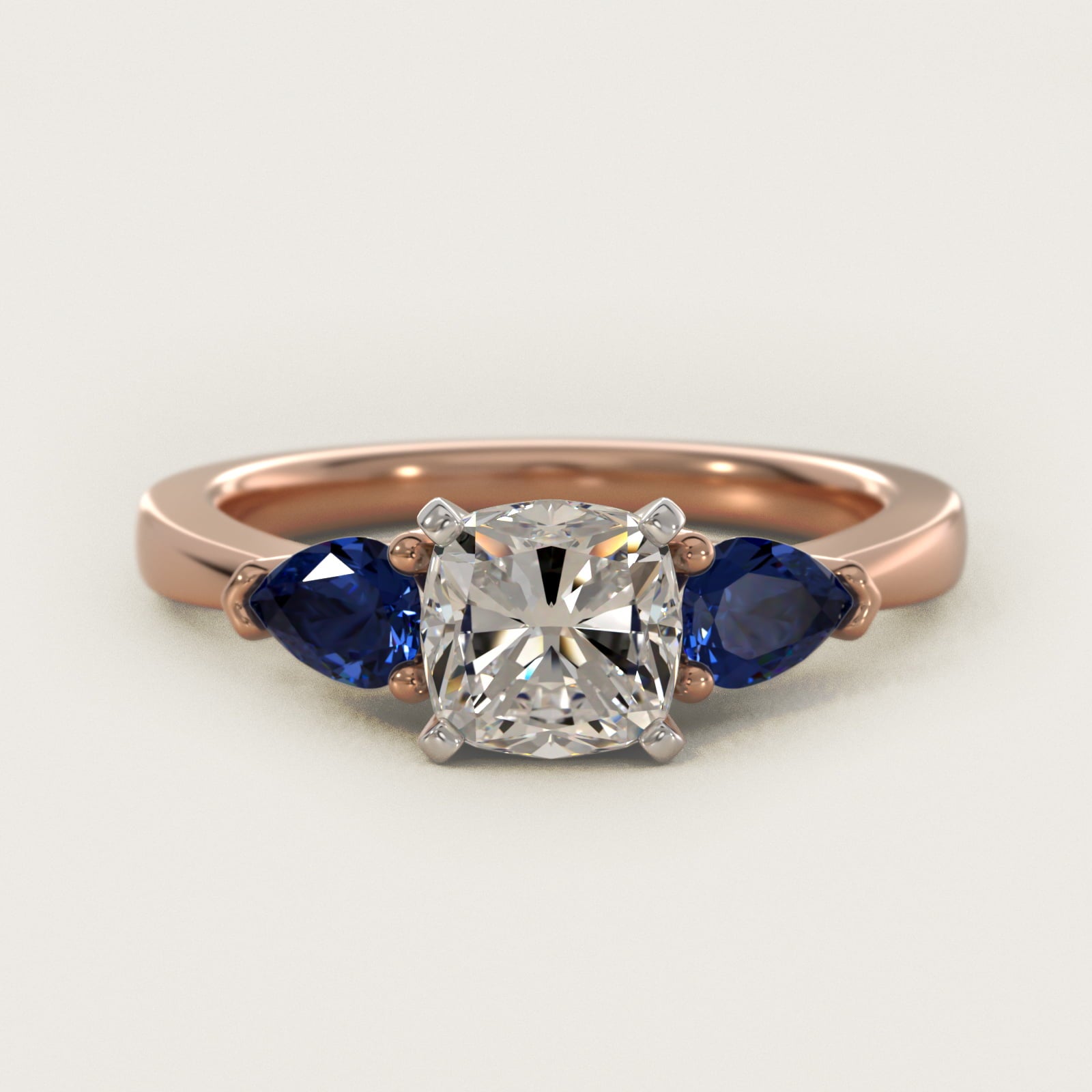 Classic Pear Shaped Sapphire Engagement Ring in 14k Rose Gold - Cushion Center