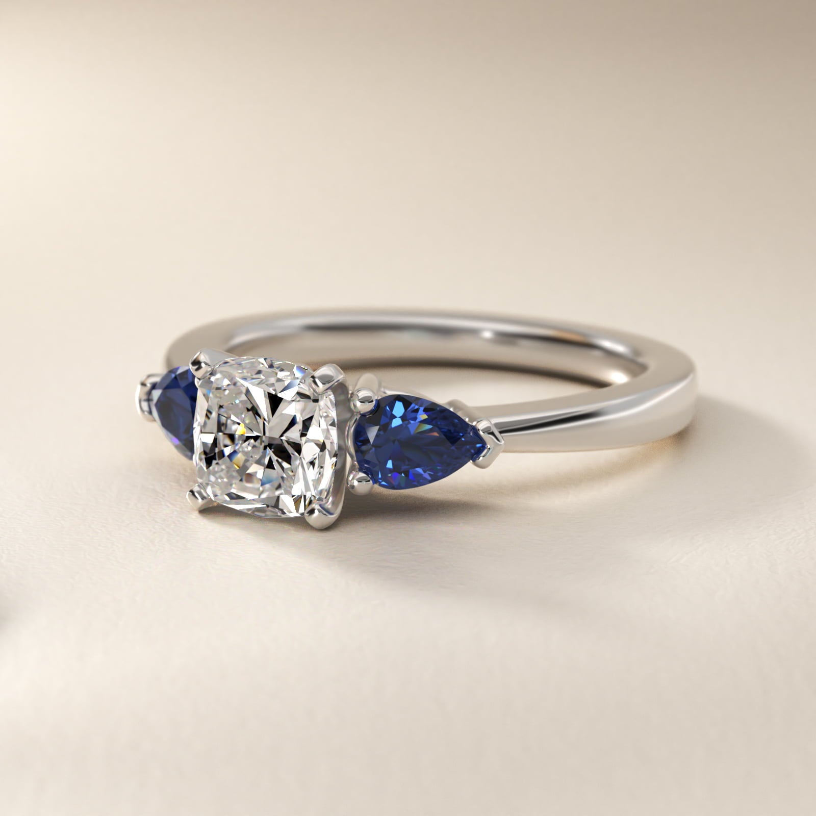 Classic Pear Shaped Sapphire Engagement Ring in Platinum - Cushion Center