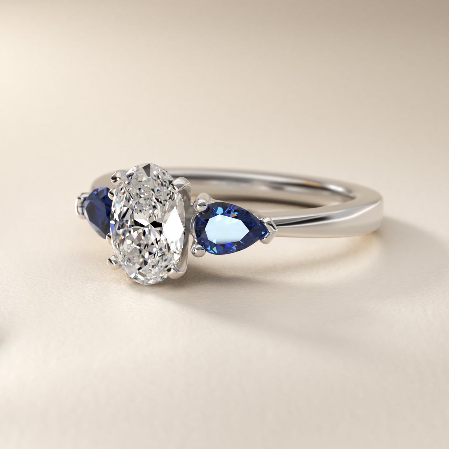 Classic Pear Shaped Sapphire Engagement Ring in Platinum - Oval Center