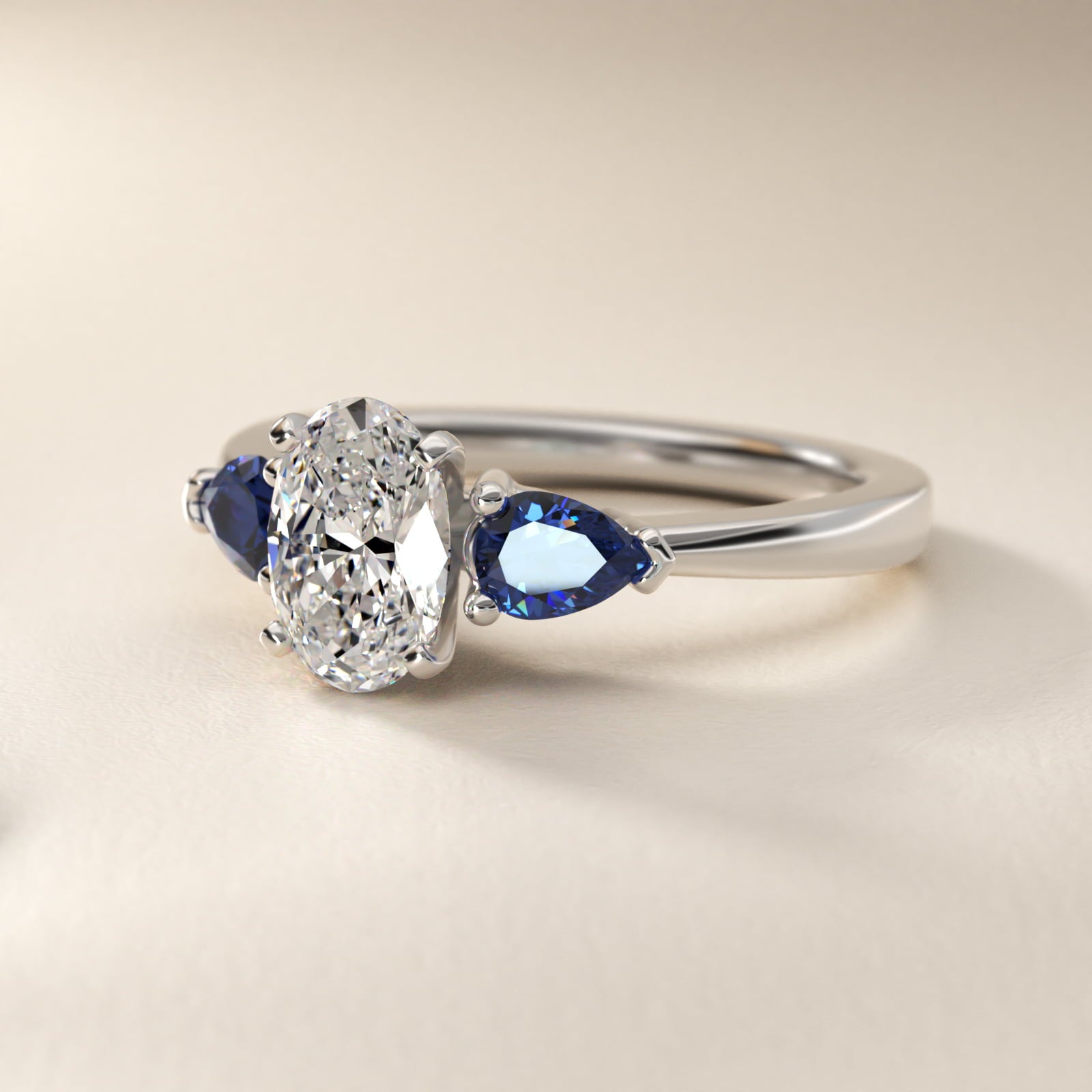 Classic Pear Shaped Sapphire Engagement Ring in Platinum - Oval Center