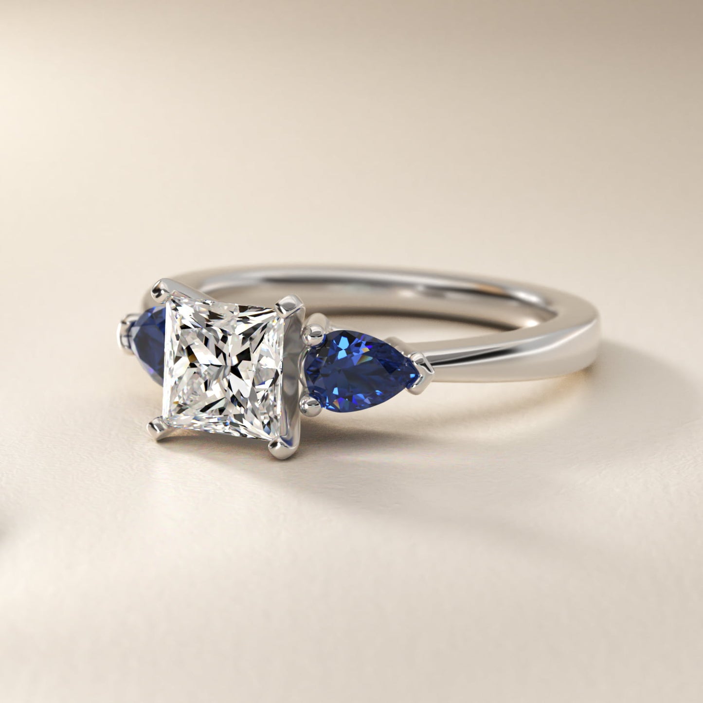Classic Pear Shaped Sapphire Engagement Ring in Platinum - Princess Center