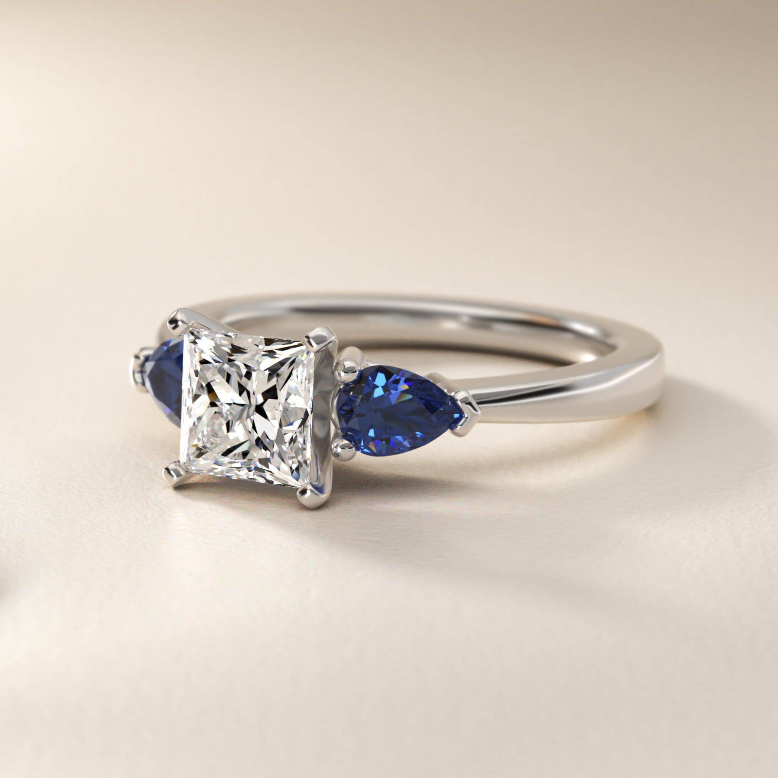 Classic Pear Shaped Sapphire Engagement Ring in Platinum - Princess Center
