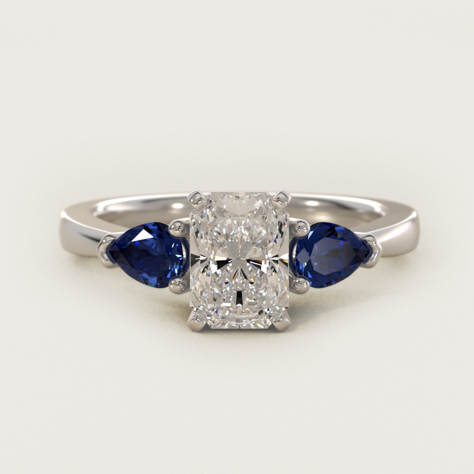 Classic Pear Shaped Sapphire Engagement Ring in 18k White Gold - Radiant Center