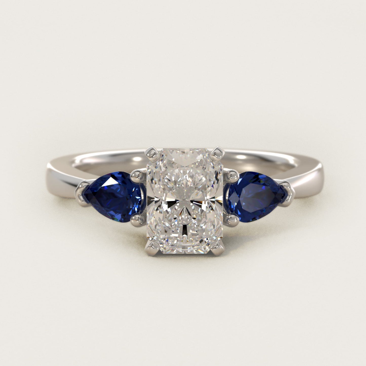 Classic Pear Shaped Sapphire Engagement Ring in Platinum - Radiant Center