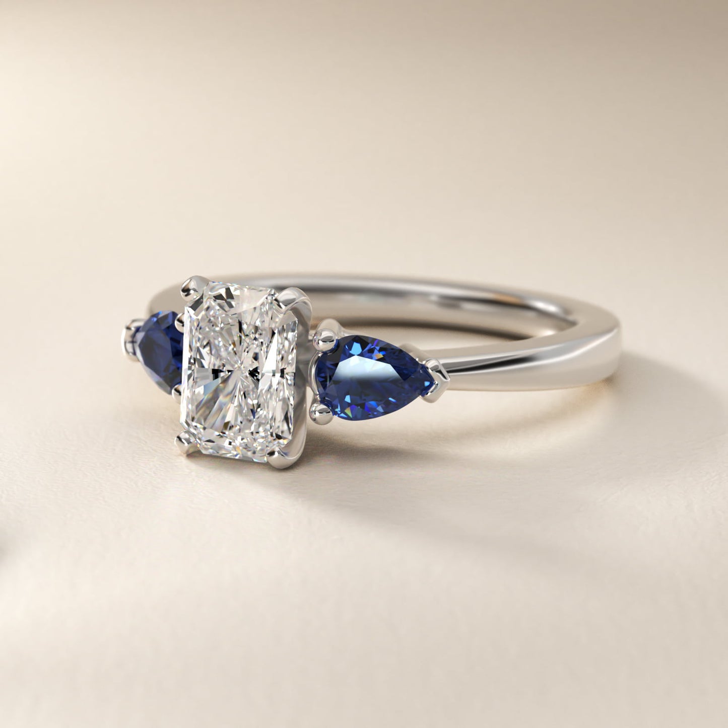 Classic Pear Shaped Sapphire Engagement Ring in Platinum - Radiant Center