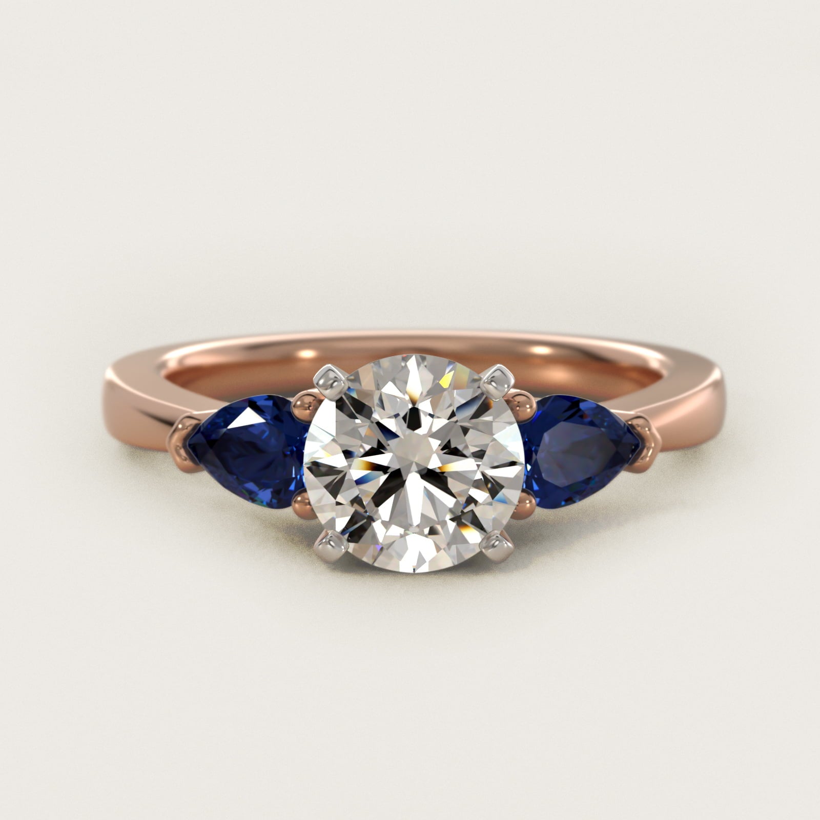Classic Pear Shaped Sapphire Engagement Ring in 14k Rose Gold - Round Center