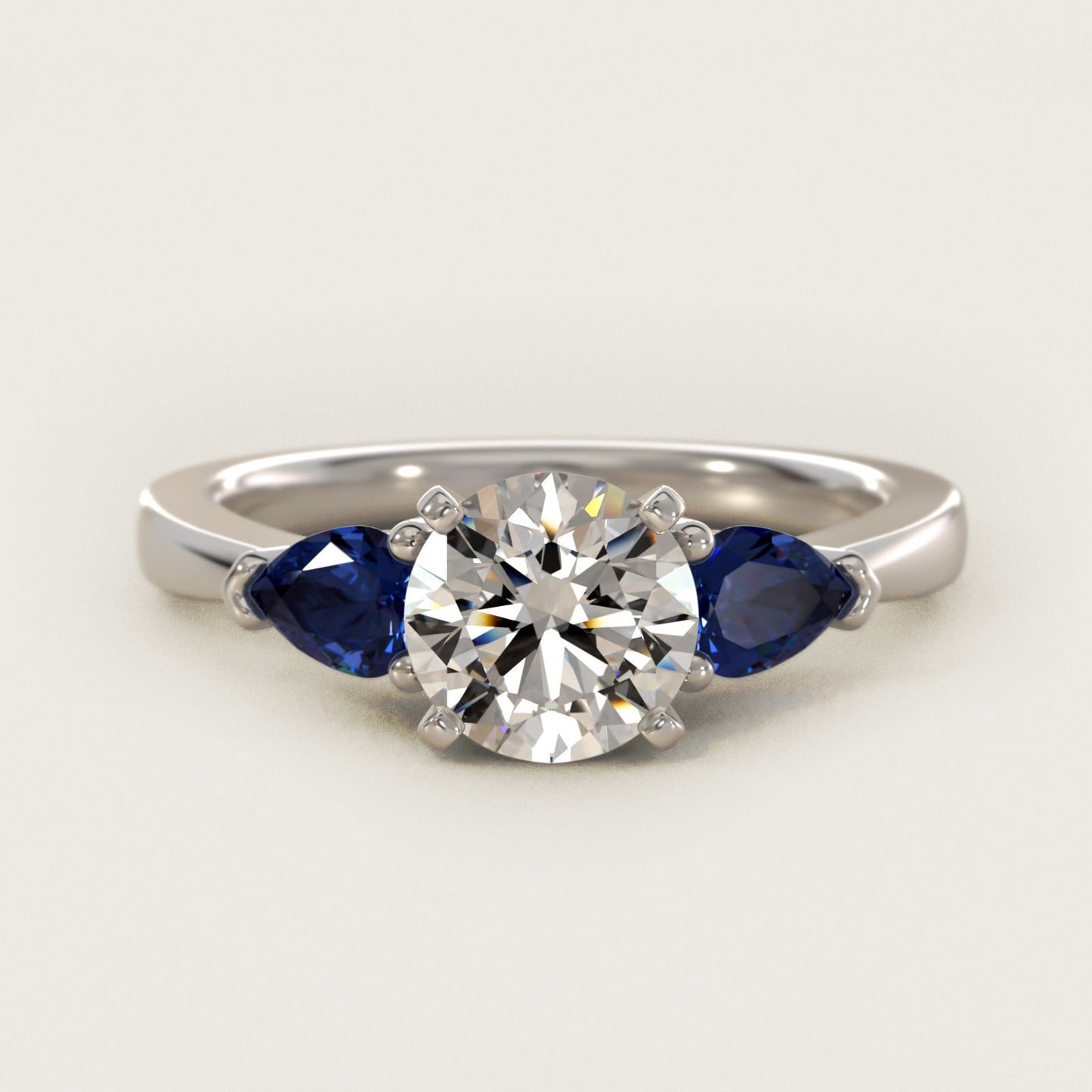 Classic Pear Shaped Sapphire Engagement Ring in Platinum - Round Center