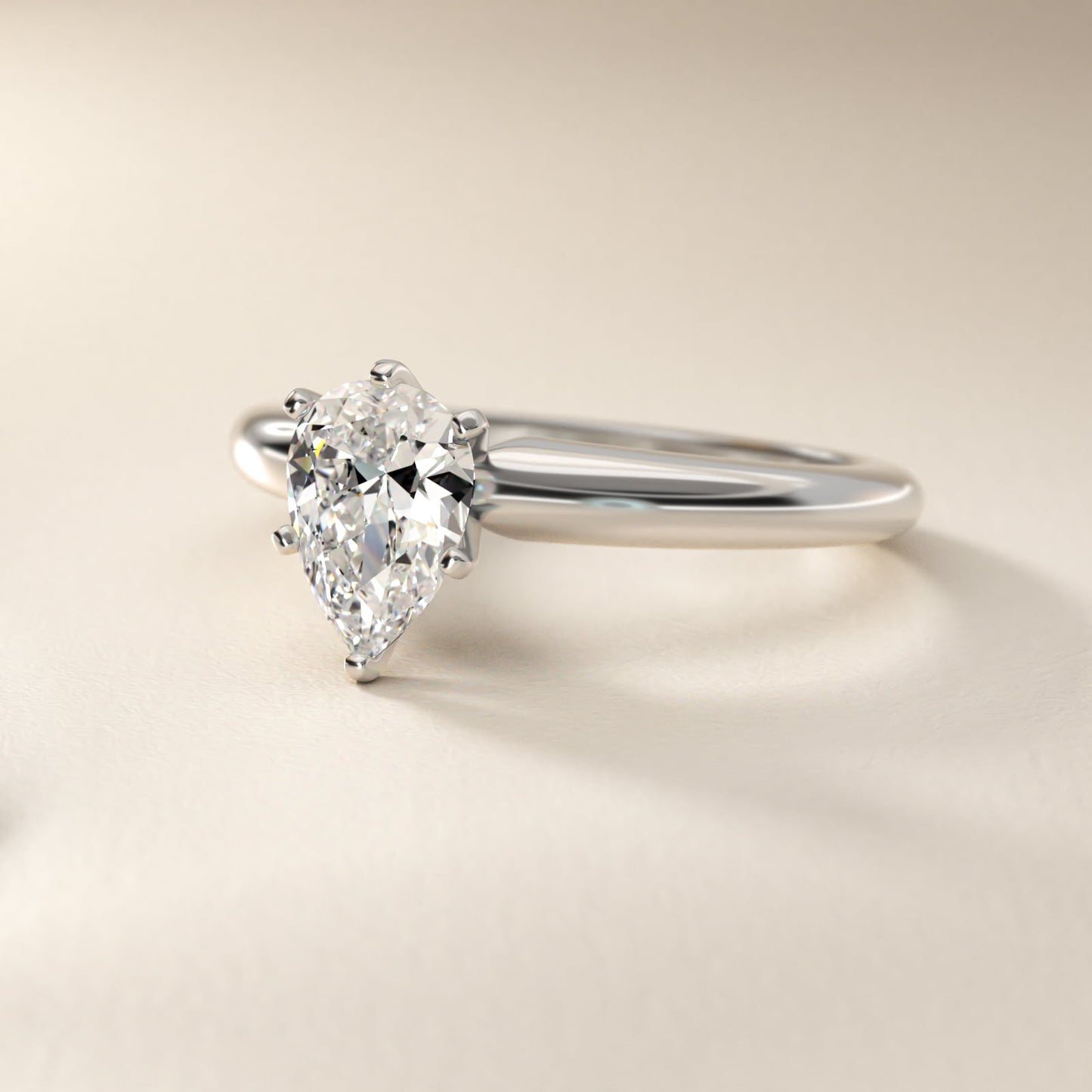 Classic Simple Solitaire Engagement Ring in 18k White Gold - Pear Center