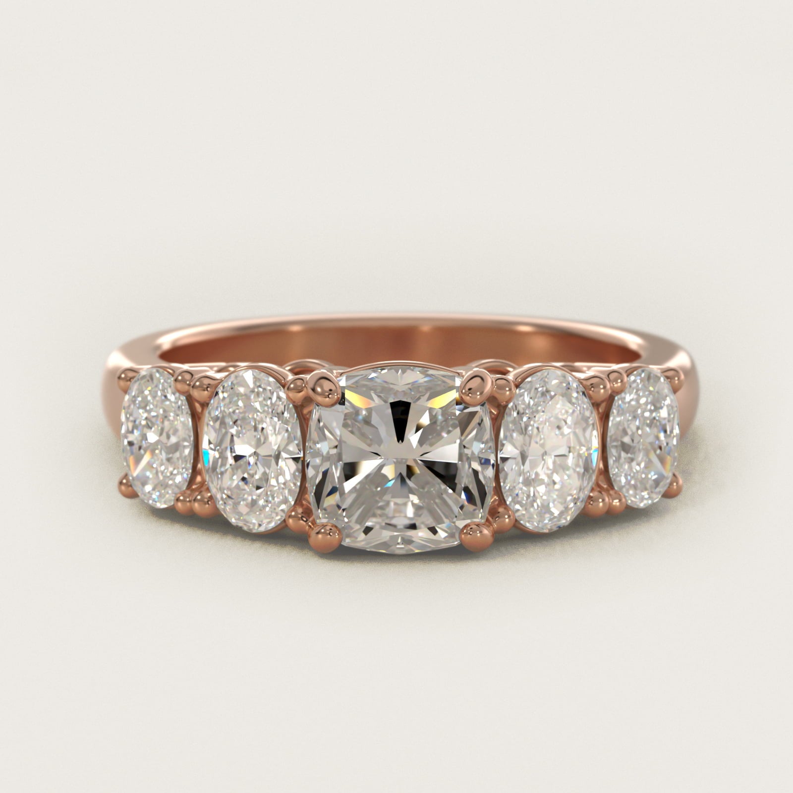 Graduated Oval Diamond Engagement Ring in 14k Rose Gold (1/2 ct. tw.) - Cushion Center