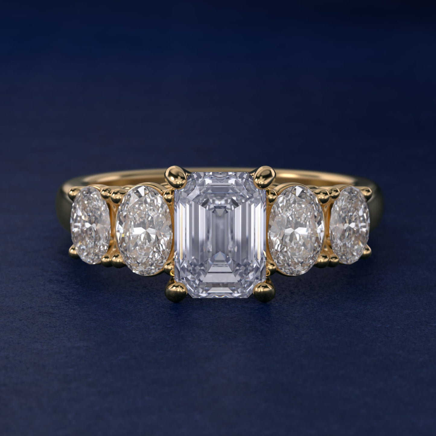 Graduated Oval Diamond Engagement Ring in 14K Yellow Gold (1/2 ct. tw.) - Emerald Center