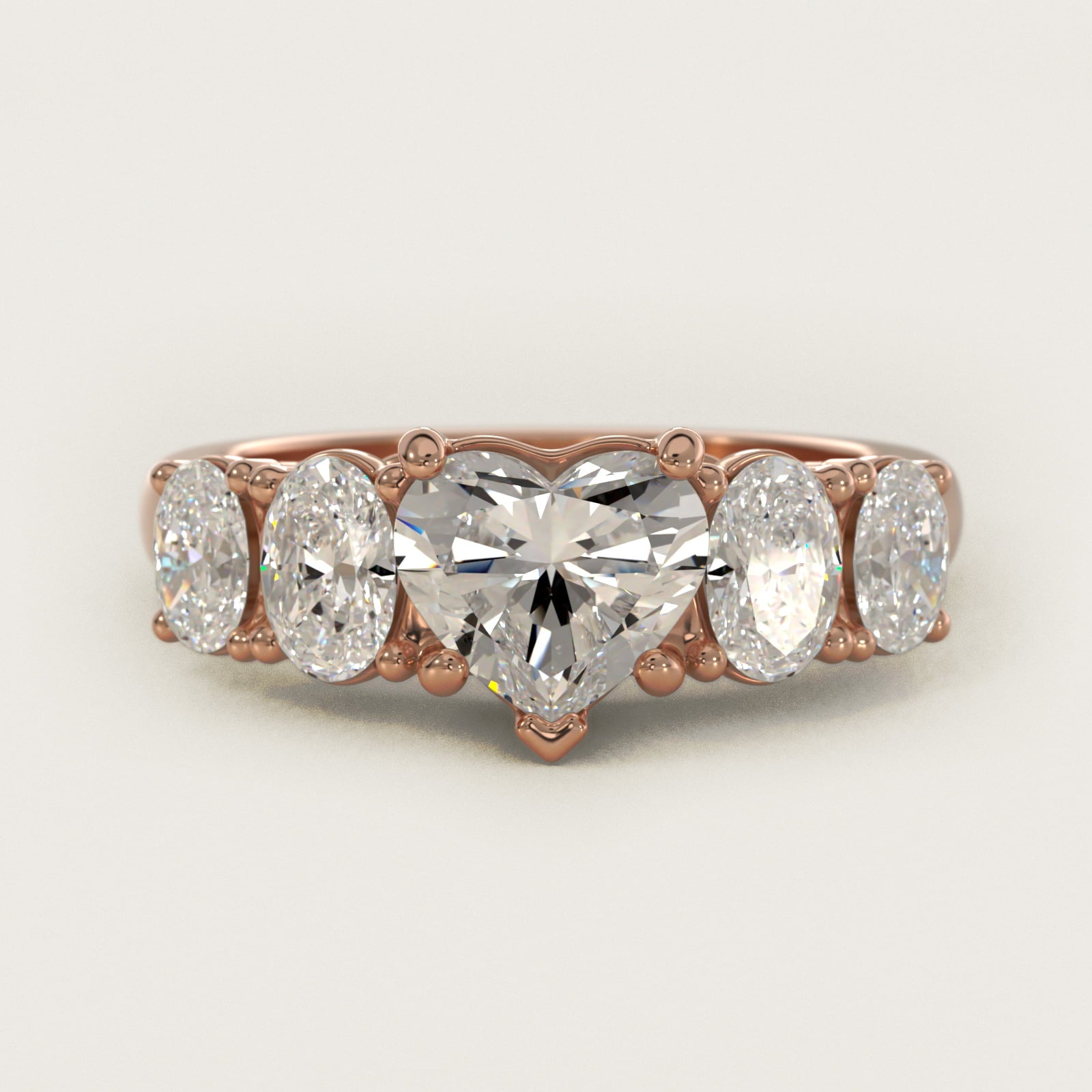 Graduated Oval Diamond Engagement Ring in 14k Rose Gold (1/2 ct. tw.) - Heart Center