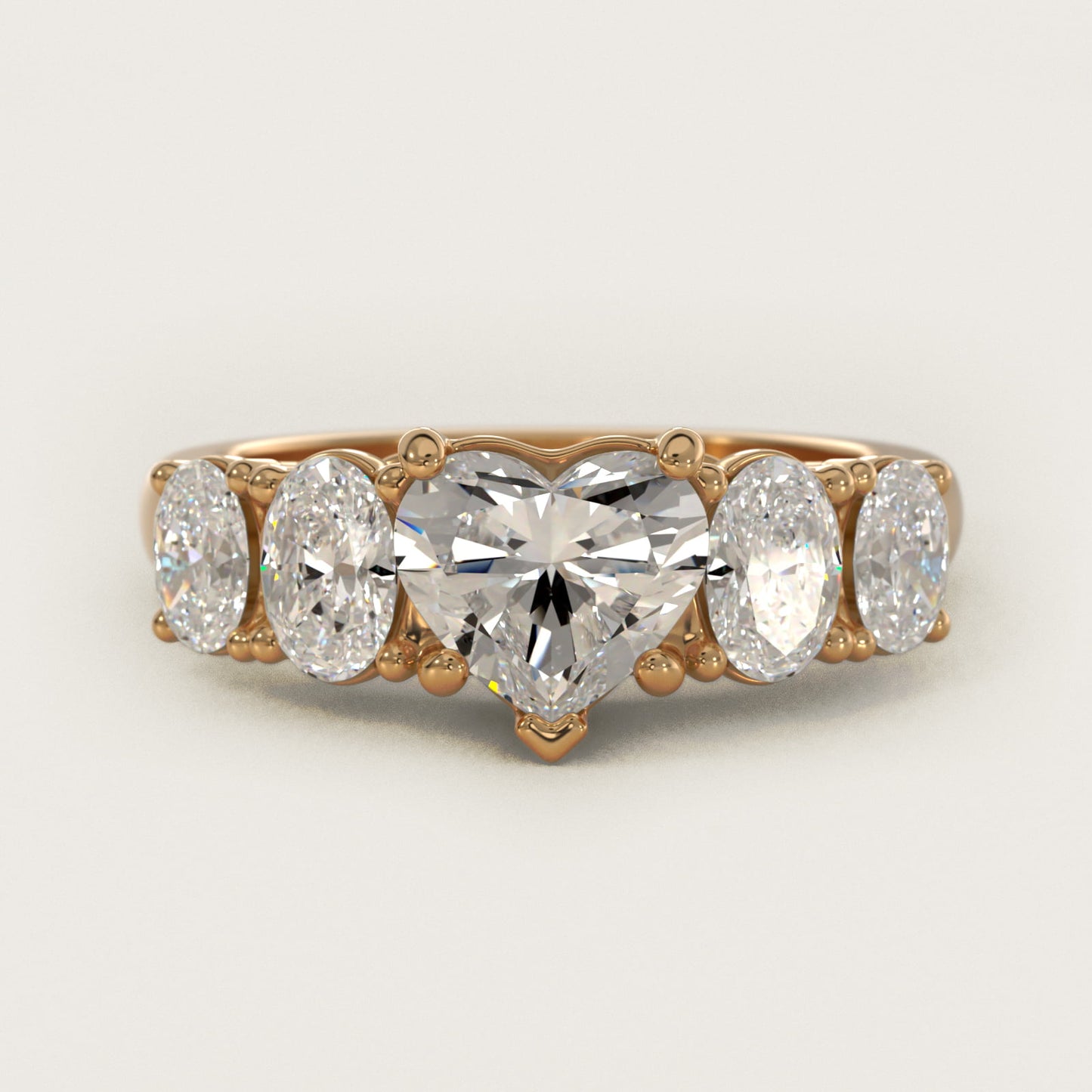 Graduated Oval Diamond Engagement Ring in 14K Yellow Gold (1/2 ct. tw.) - Heart Center