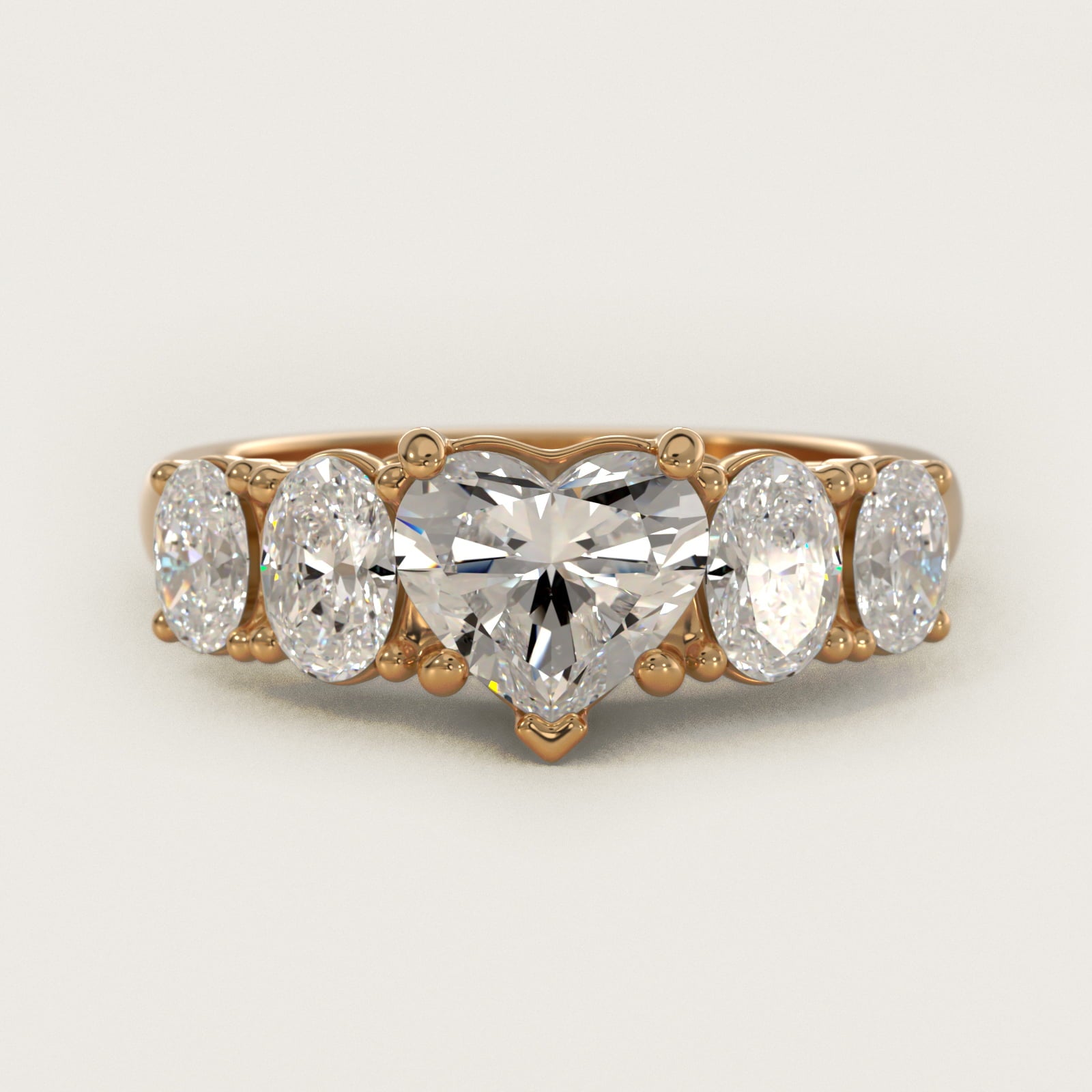 Graduated Oval Diamond Engagement Ring in 14K Yellow Gold (1/2 ct. tw.) - Heart Center