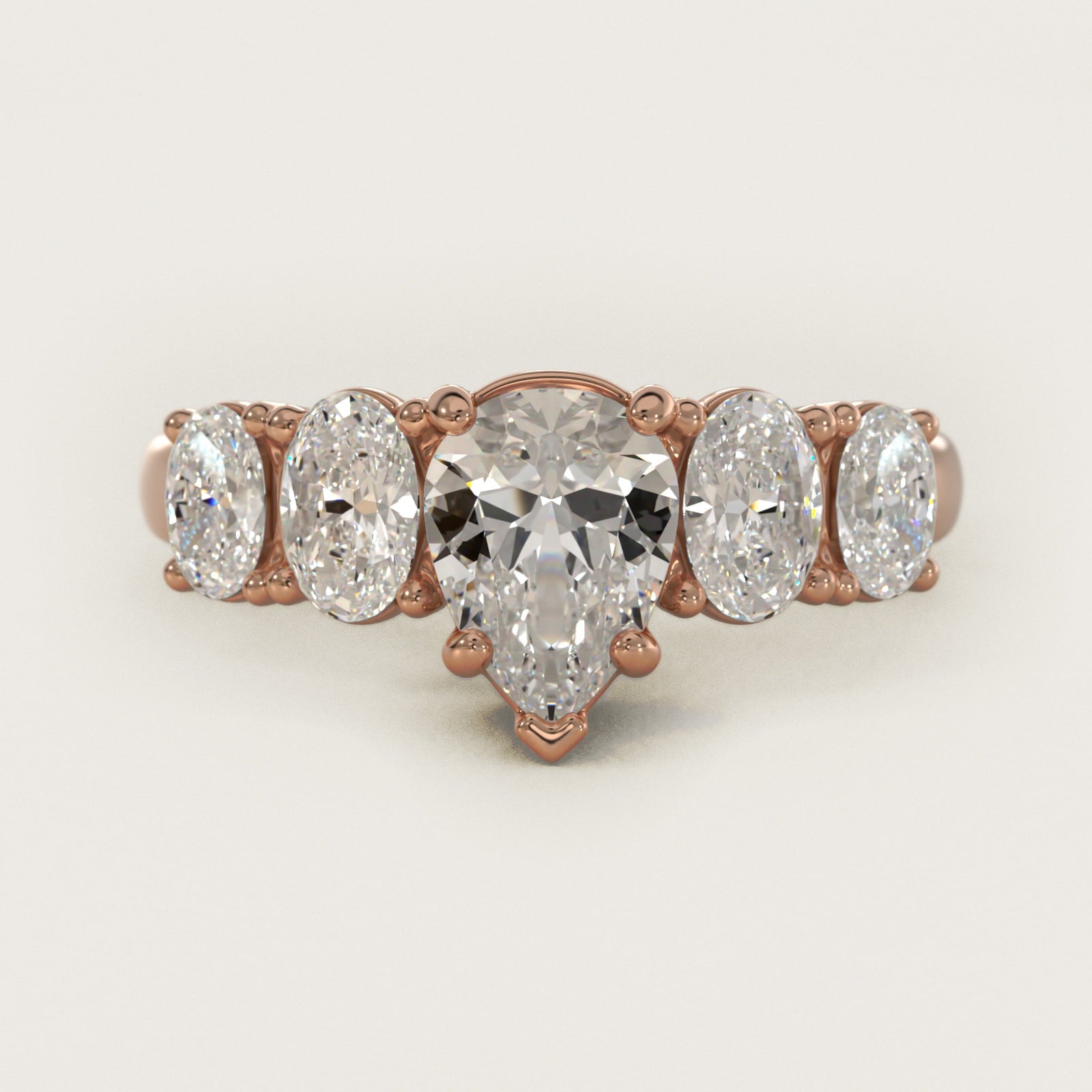 Graduated Oval Diamond Engagement Ring in 14k Rose Gold (1/2 ct. tw.) - Pear Center