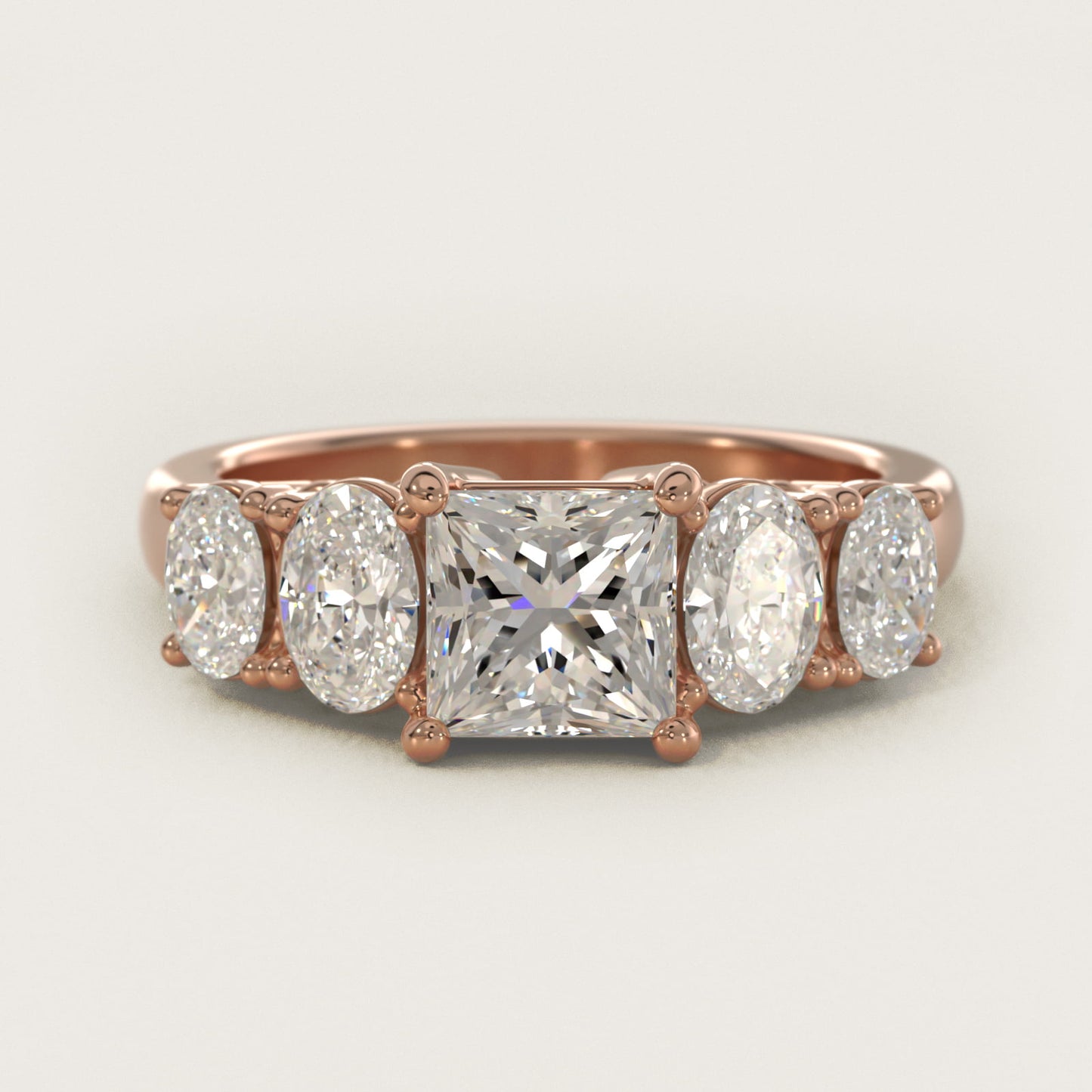 Graduated Oval Diamond Engagement Ring in 14k Rose Gold (1/2 ct. tw.) - Princess Center