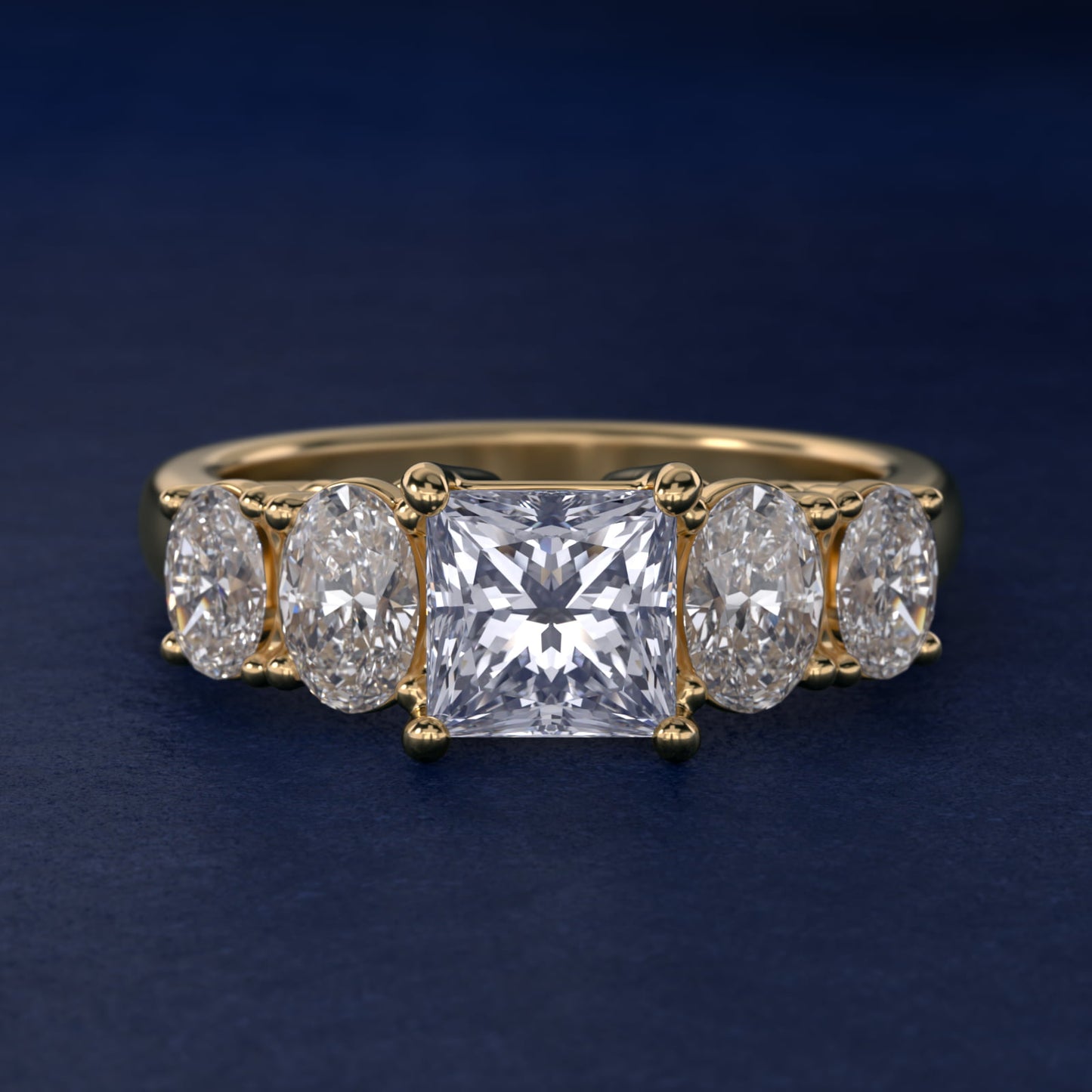 Graduated Oval Diamond Engagement Ring in 14K Yellow Gold (1/2 ct. tw.) - Princess Center